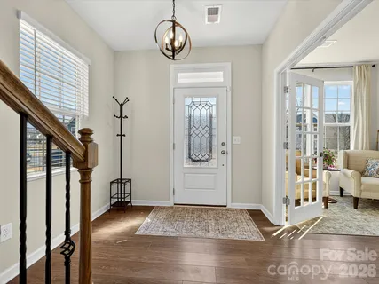 a view of a living room and entryway