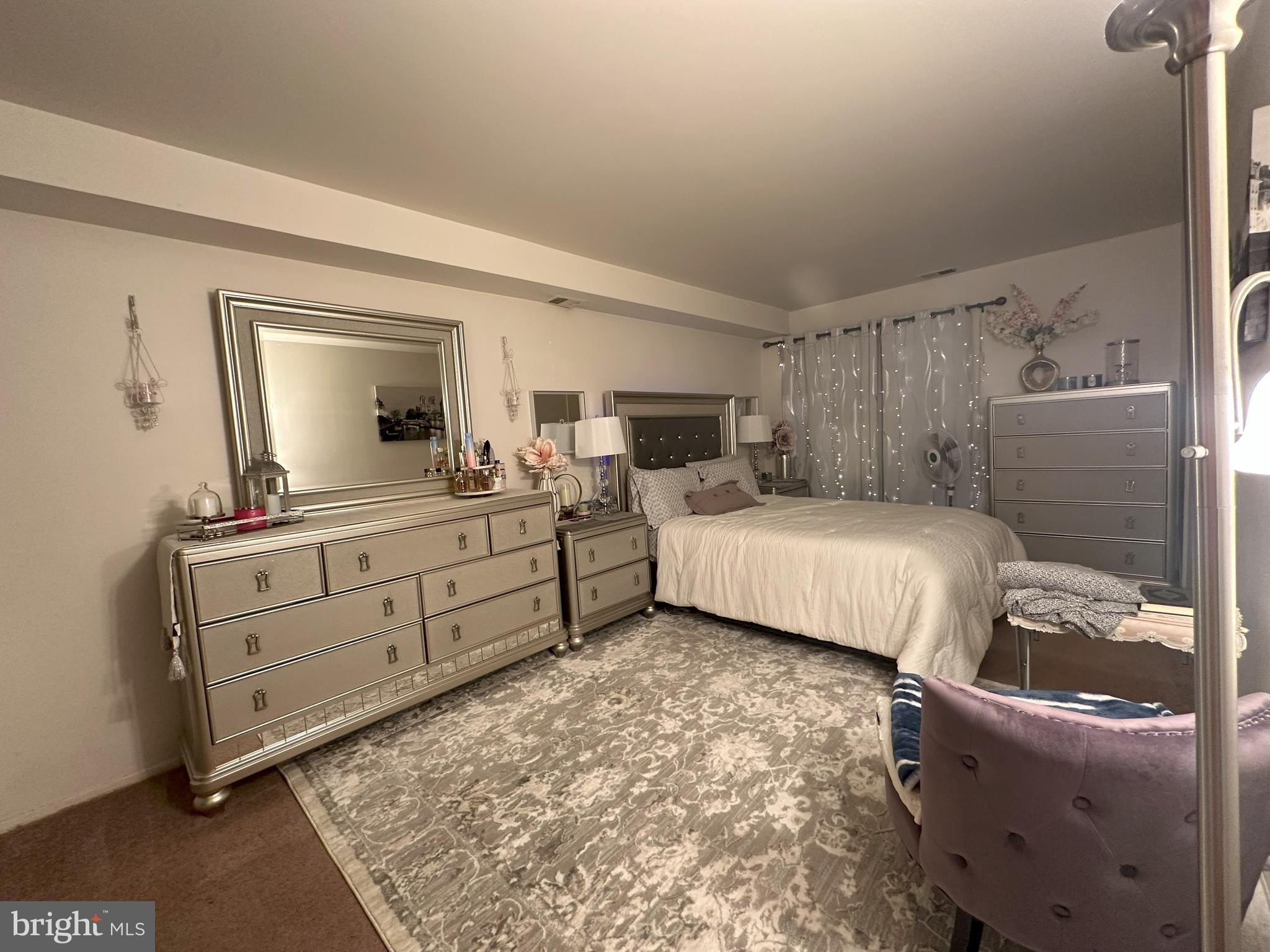 7525 Calvert Street Philadelphia, PA 19152 - Photo 13 of 38 a bedroom with a bed and a dresser