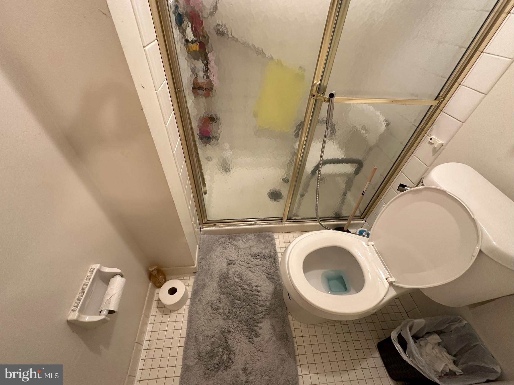 7525 Calvert Street Philadelphia, PA 19152 - Photo 16 of 38 a bathroom with a toilet and a mirror