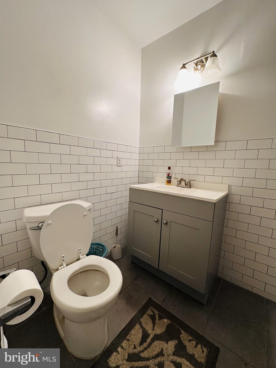 7525 Calvert Street Philadelphia, PA 19152 - Photo 32 of 38 a bathroom with a toilet sink and mirror