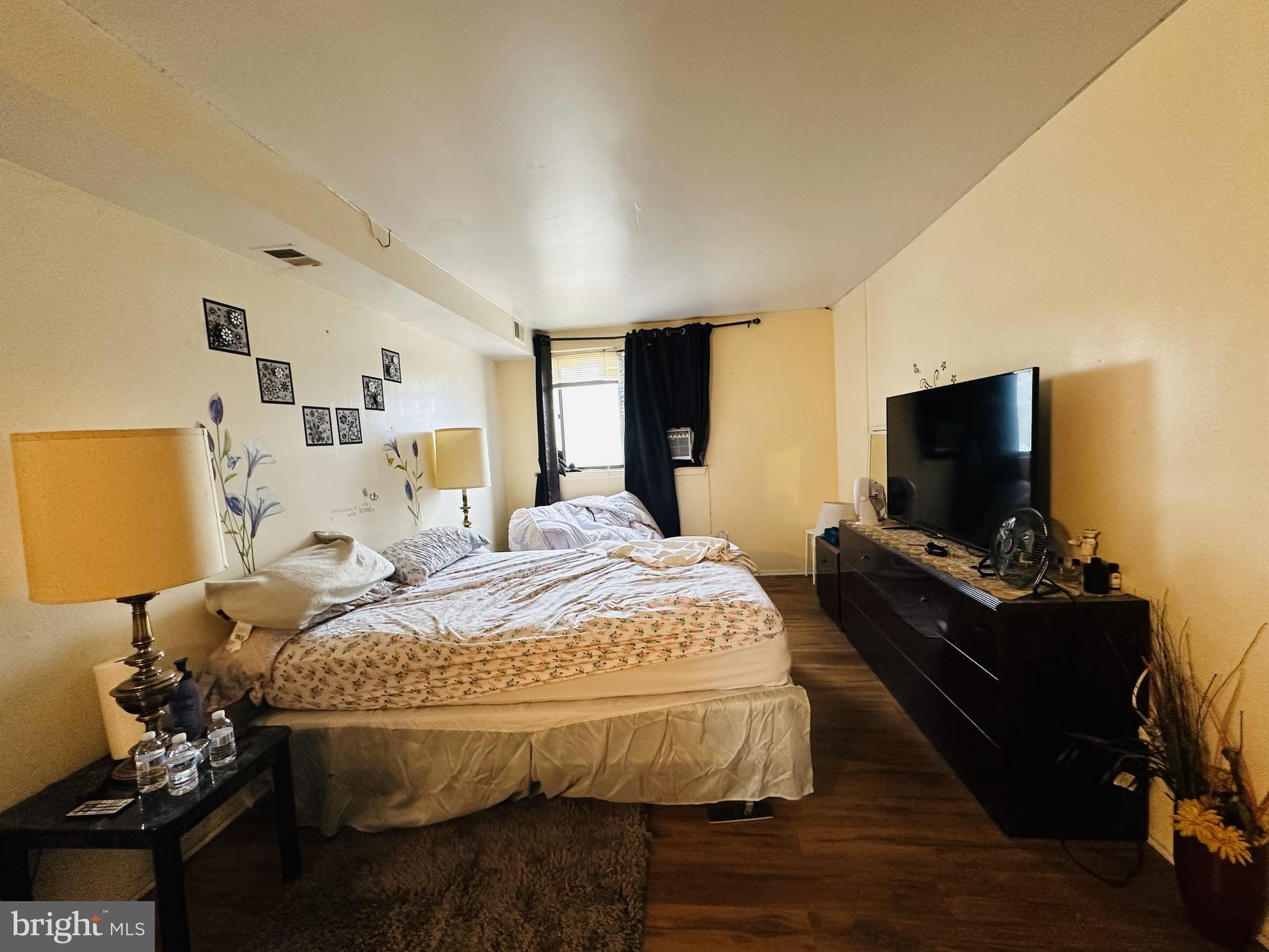 7525 Calvert Street Philadelphia, PA 19152 - Photo 36 of 38 a bed room with bed and a flat screen tv