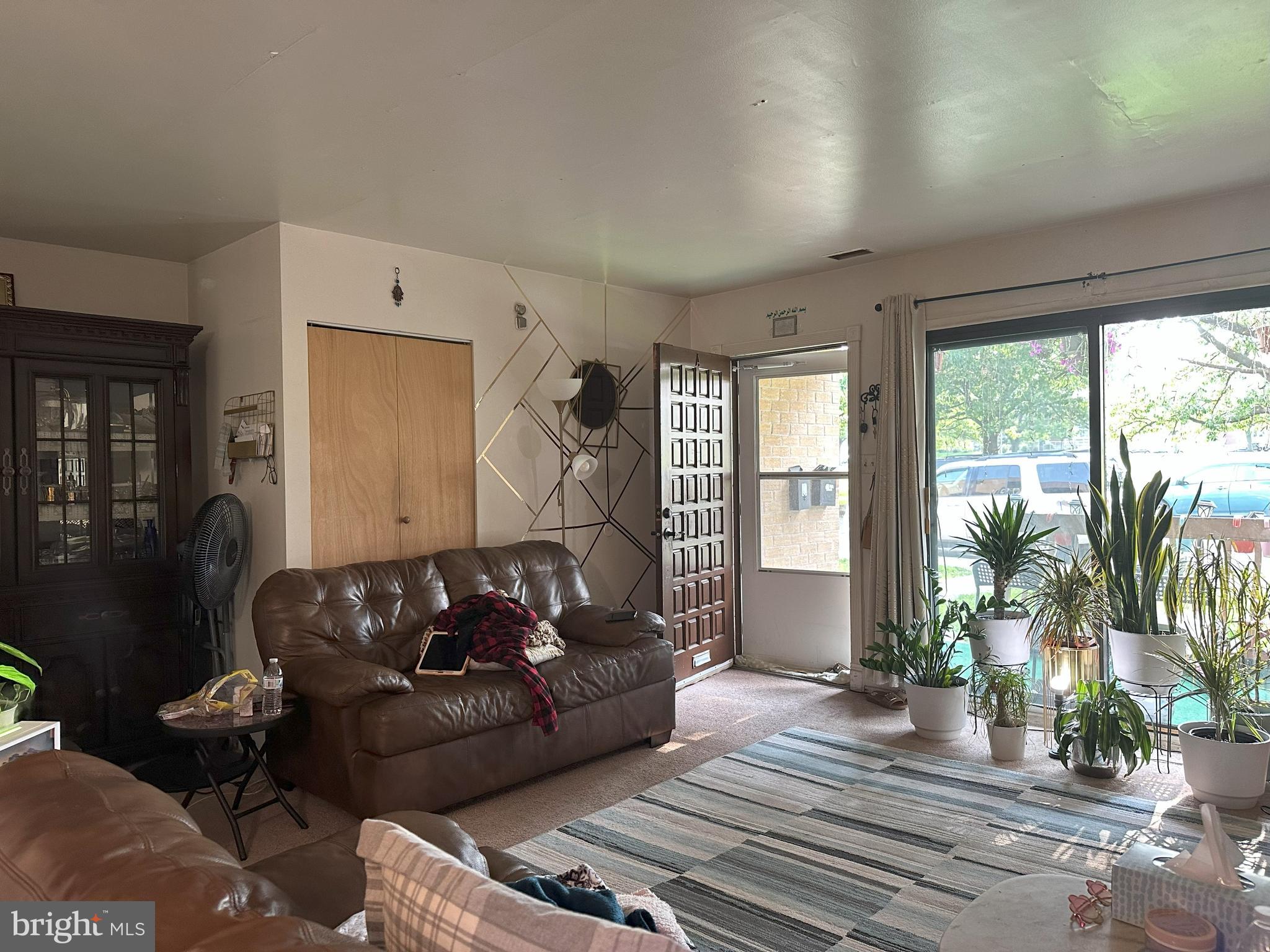 7525 Calvert Street Philadelphia, PA 19152 - Photo 7 of 38 a living room with furniture and a large window