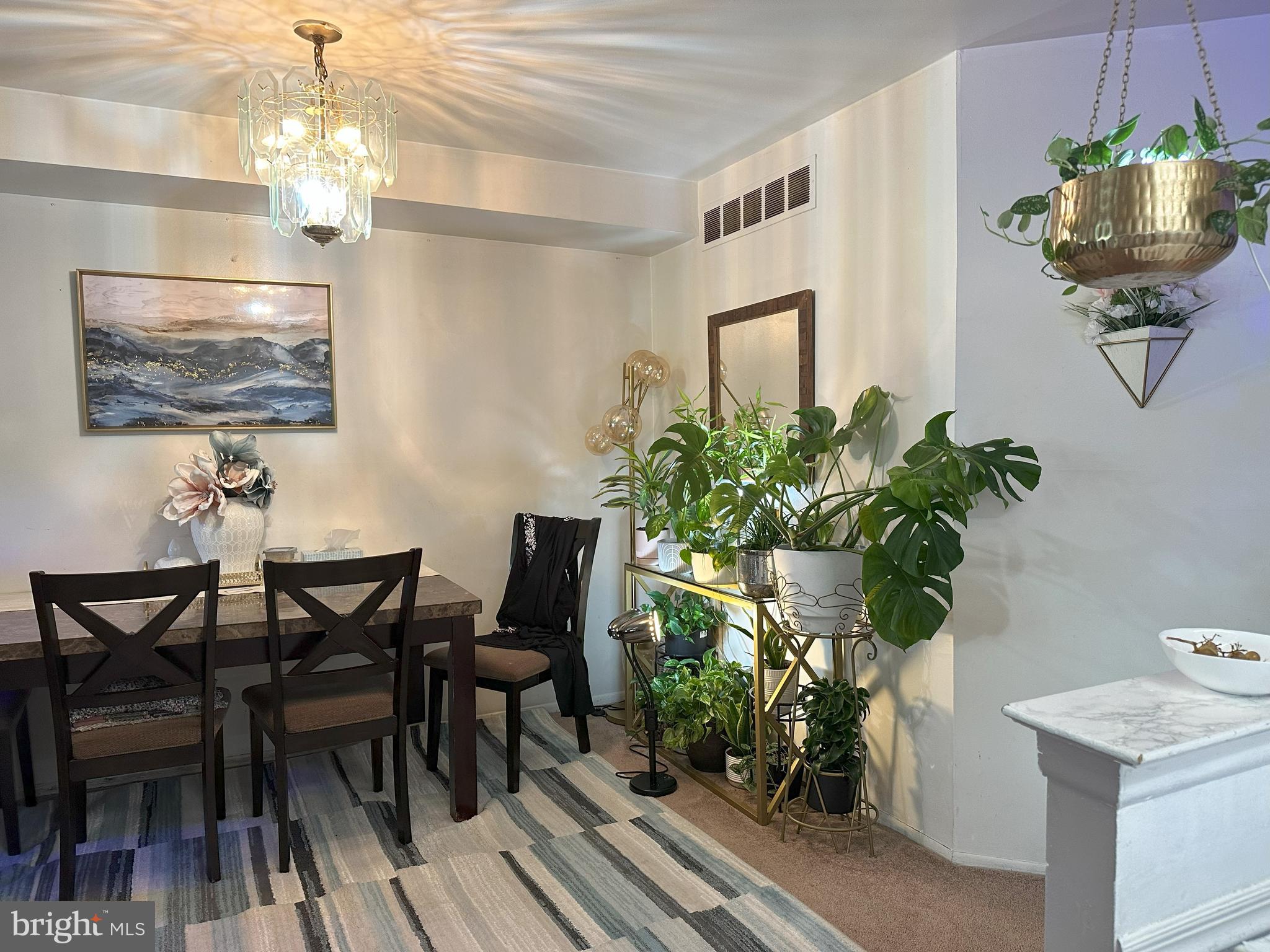 7525 Calvert Street Philadelphia, PA 19152 - Photo 9 of 38 a dining room with furniture and chandelier