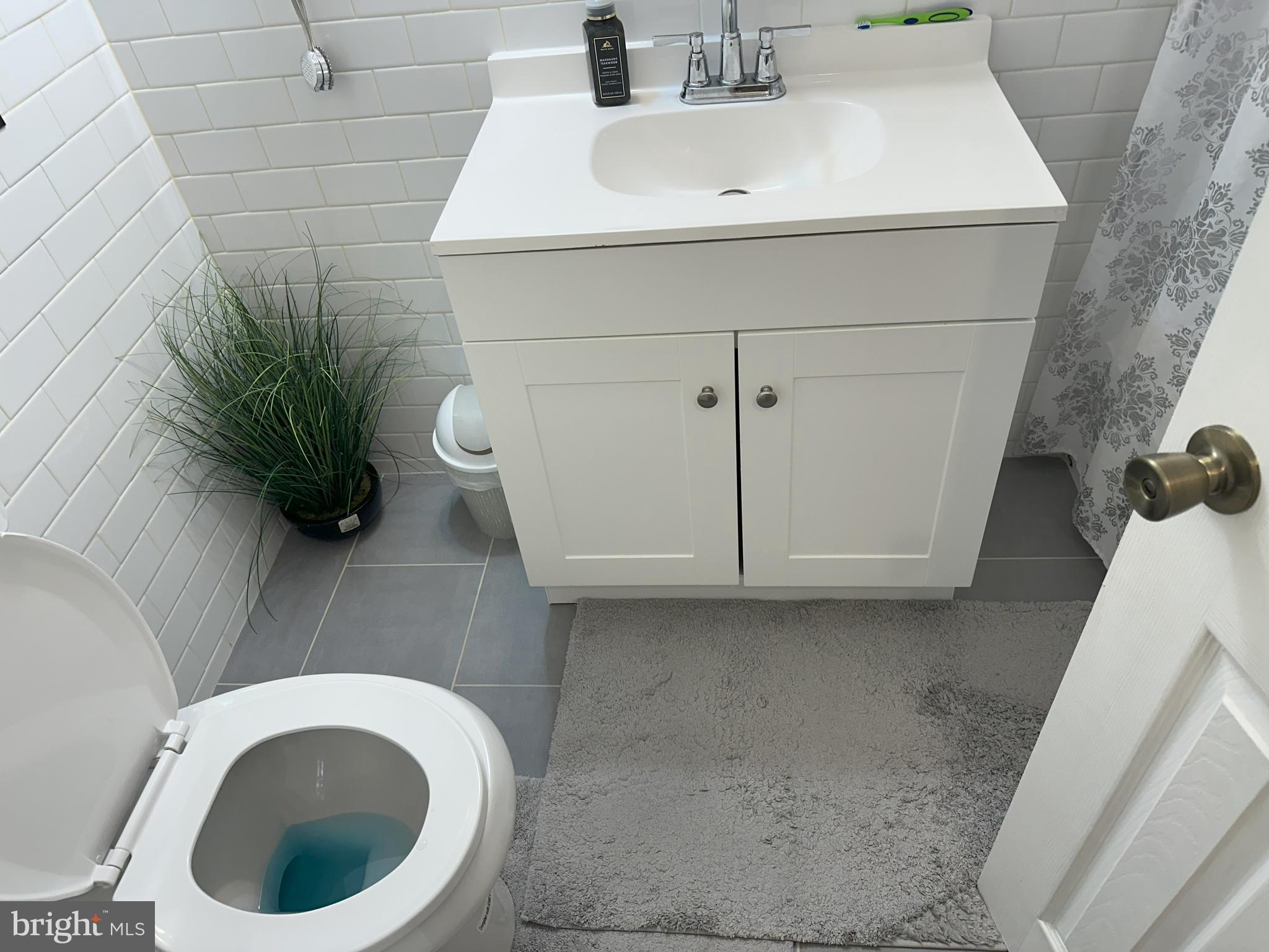 7525 Calvert Street Philadelphia, PA 19152 - Photo 10 of 38 a bathroom with a sink and a vanity