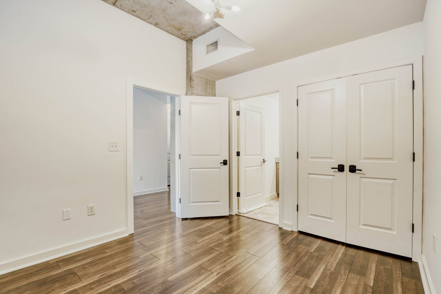360 Nueces Street, Unit 2004 Austin, TX 78701 - Photo 31 of 34 a view of an empty room with wooden floor