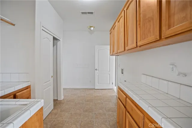 a view of a kitchen cabinets and a sink