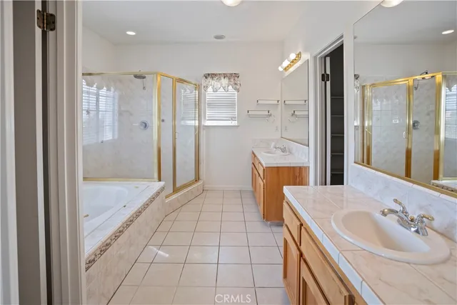 a bathroom with a sink a mirror and a shower