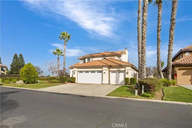 a view of a house with a garden and pathway