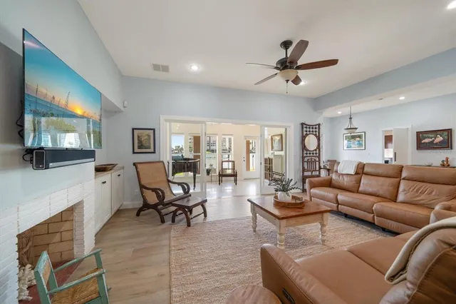 a living room with furniture and a piano