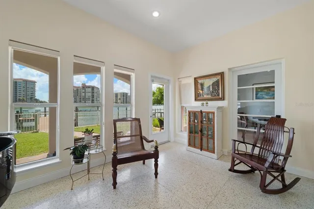 a dining room with furniture entryway and wooden floor