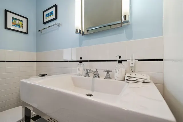 a spacious bedroom with a bed couch and window