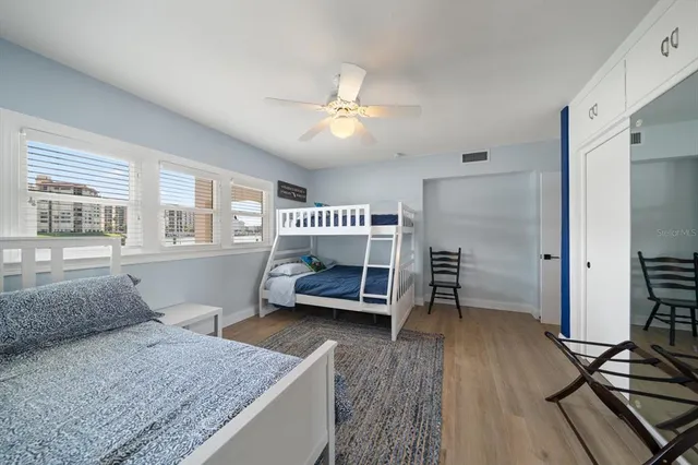 a bathroom with a granite countertop sink mirror and bathtub