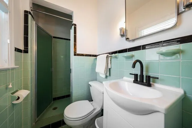 a view of a lake with a table and chairs