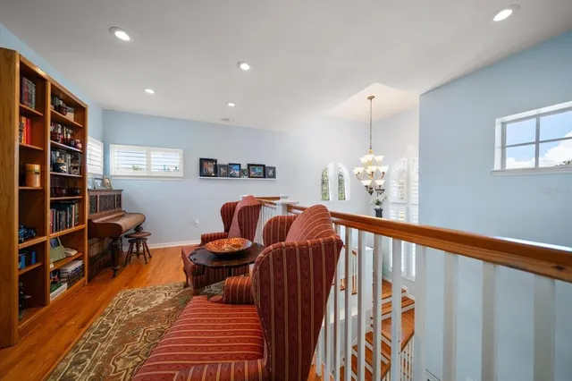 a front view of a house with a garden and plants