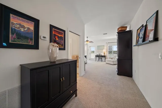 a view of a house with brick walls and a yard with plants