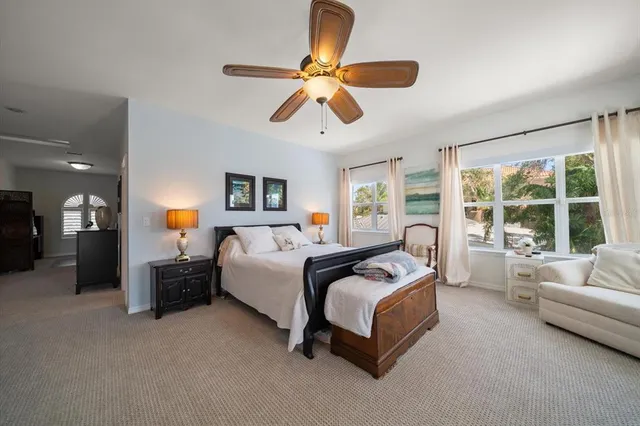 an aerial view of residential houses with outdoor space and lake view