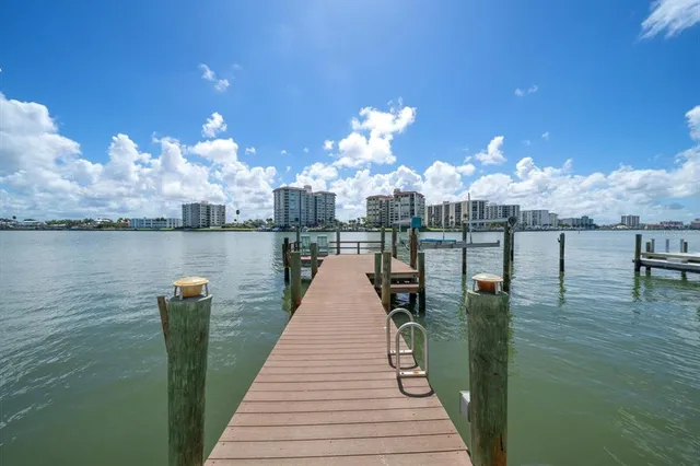 a view of a porch with wooden floor and furniture
