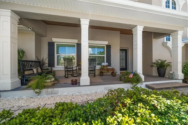 a room with pool table and windows