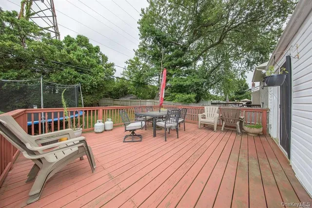 a view of a chairs on wooden deck