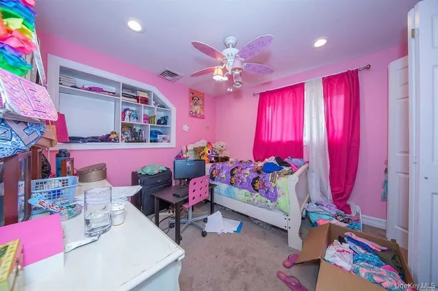 a bedroom with furniture and a chandelier