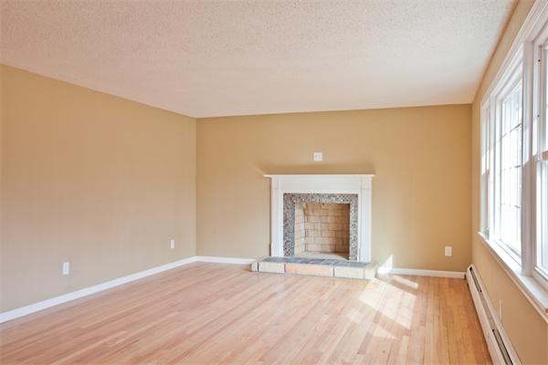 140 Druid Hill Road Springfield, MA 01129 - Photo 9 of 23 an empty room with wooden floor and windows