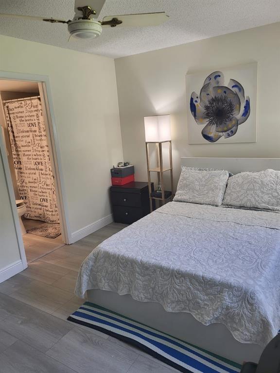 8305 Northwest 61st Street, Unit C110 Tamarac, FL 33321 - Photo 15 of 15 a bedroom with a bed and a window