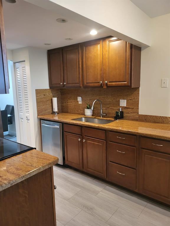 8305 Northwest 61st Street, Unit C110 Tamarac, FL 33321 - Photo 2 of 15 a kitchen with sink and cabinets