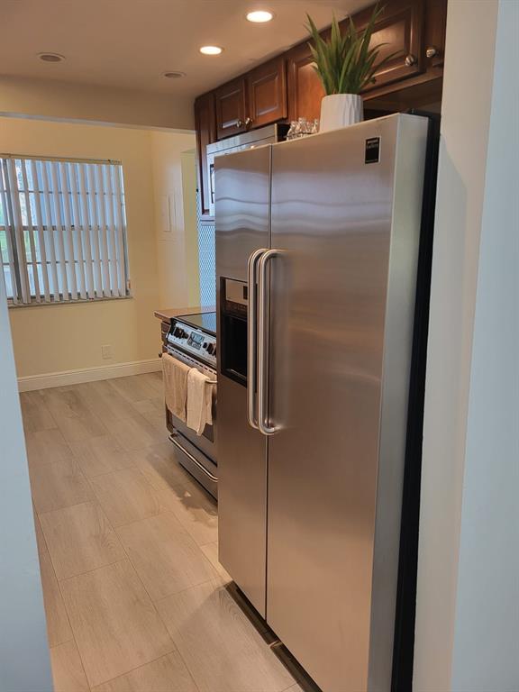 8305 Northwest 61st Street, Unit C110 Tamarac, FL 33321 - Photo 3 of 15 a close view of a refrigerator in kitchen and a window