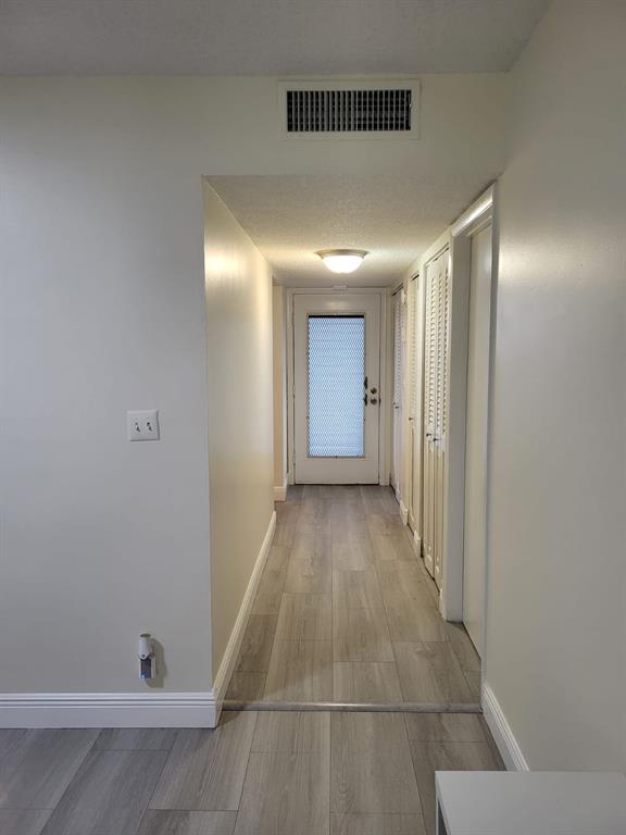 8305 Northwest 61st Street, Unit C110 Tamarac, FL 33321 - Photo 7 of 15 a view of a hallway