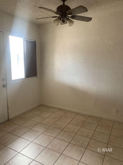 412 Sahara Drive Ridgecrest, CA 93555 - Photo 8 of 17 an empty room with a empty space and windows