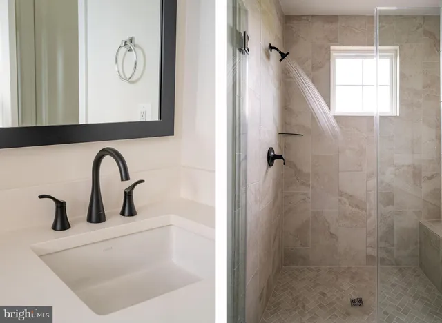 a bathroom with a shower sink and mirror