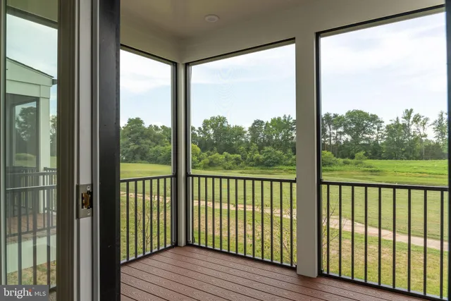 a view of a balcony with wooden floor