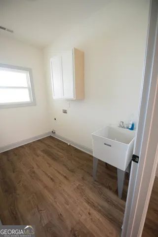 a view of a room that has a sink and a window in it
