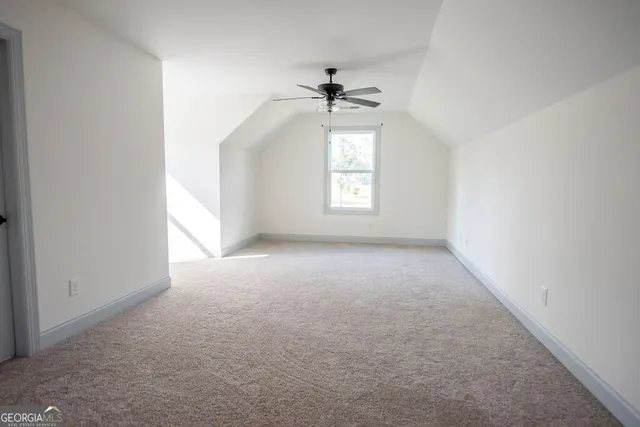 a bathroom with a toilet a sink and a window