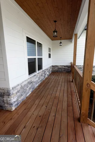a view of backyard with wooden floor