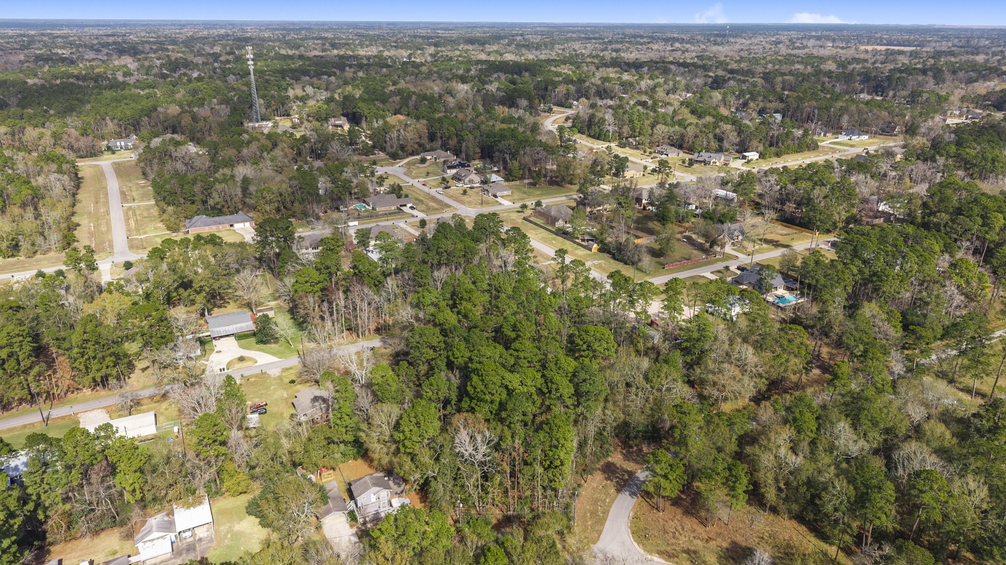 344 Magnolia Point Drive Huffman, TX 77336 - Photo 8 of 17 an aerial view of residential houses with outdoor space
