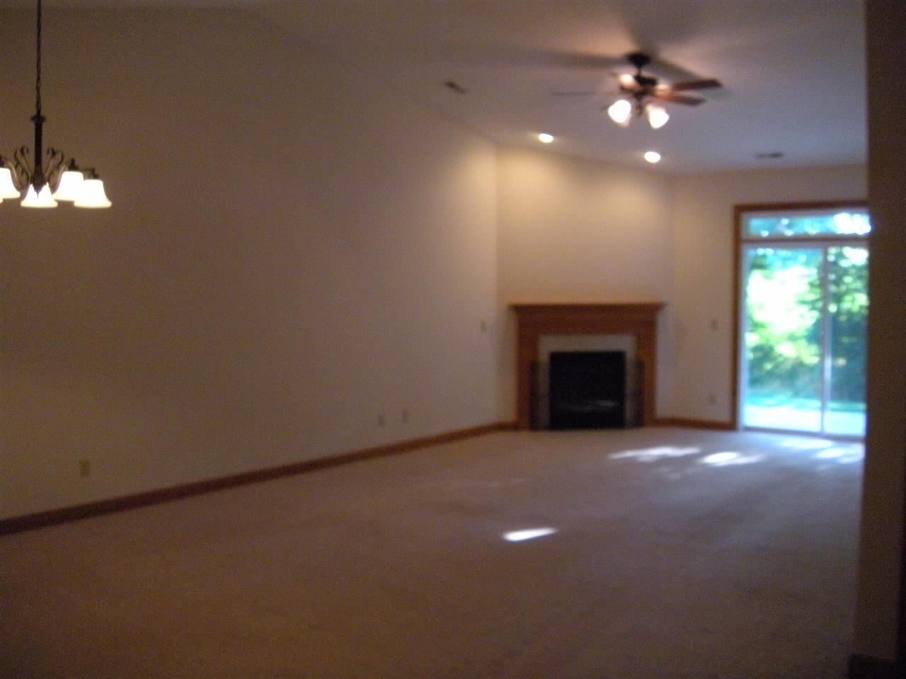 10337 Marblewing Road Roscoe, IL 61073 - Photo 9 of 14 a view of empty room with a fireplace