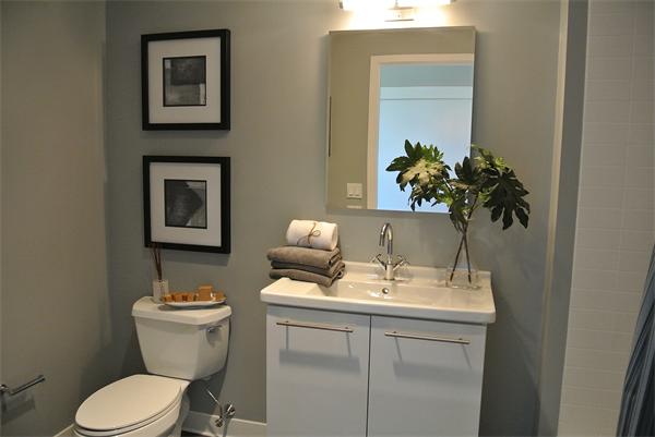 2 Earhart Street, Unit 204 Cambridge, MA 02141 - Photo 5 of 11 a bathroom with a toilet a sink and mirror