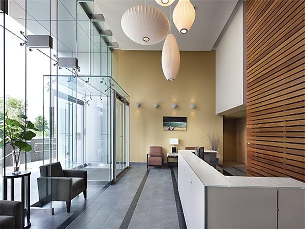 2 Earhart Street, Unit 204 Cambridge, MA 02141 - Photo 8 of 11 a kitchen with stainless steel appliances kitchen island granite countertop a sink and cabinets