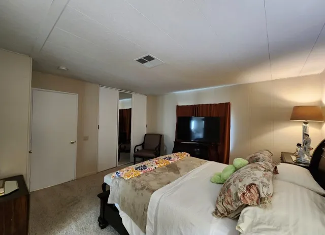 a bathroom with a toilet a sink and a mirror