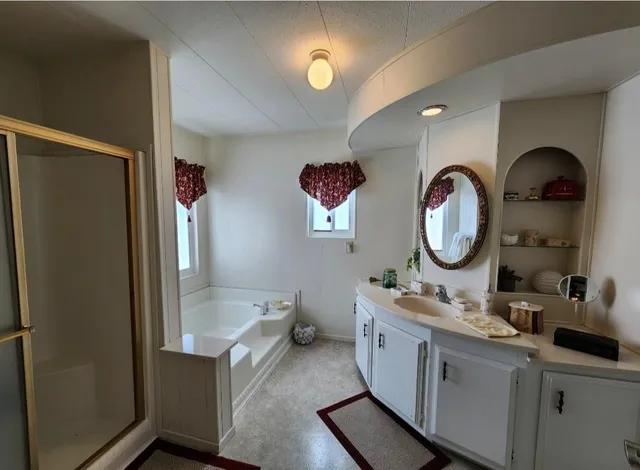 a bathroom with a sink a toilet and bathtub