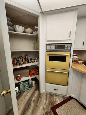a refrigerator freezer sitting inside of a kitchen