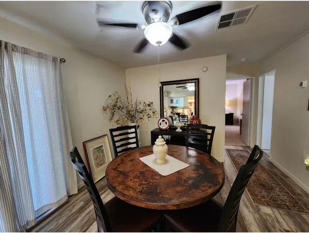 a view of a backyard with table and chairs