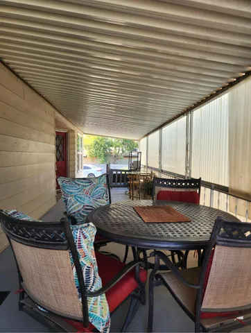a view of a glass door with a rug
