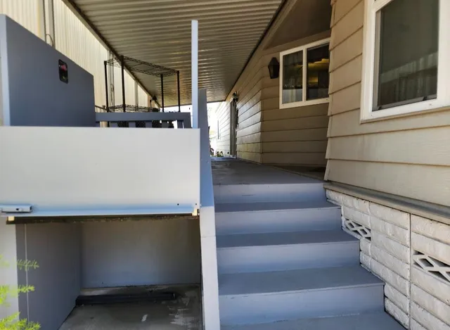 a view of a backyard with chairs