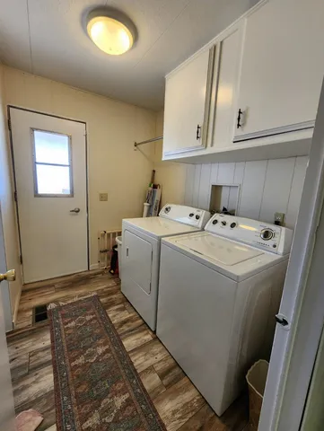 a bathroom with a sink and mirror with toilet