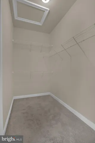 a view of room with window and ceiling fan