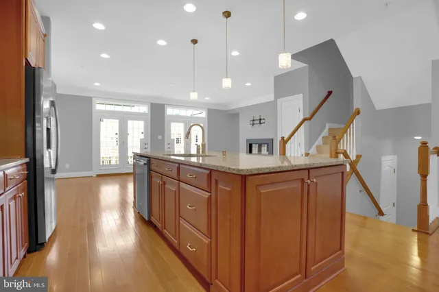 a view of a house with a tree in front of it