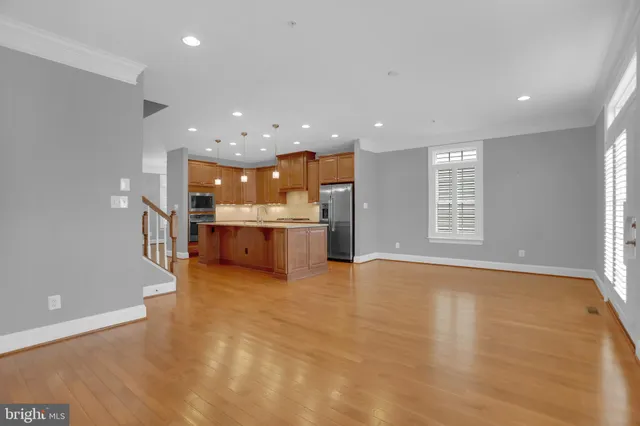 a view of a house with wooden deck