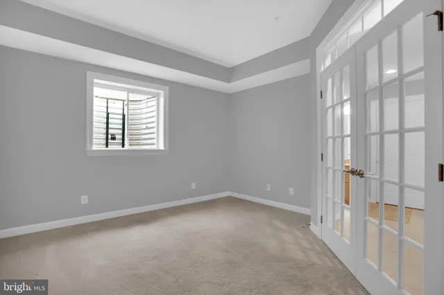 a couple of cars parked in front of a house